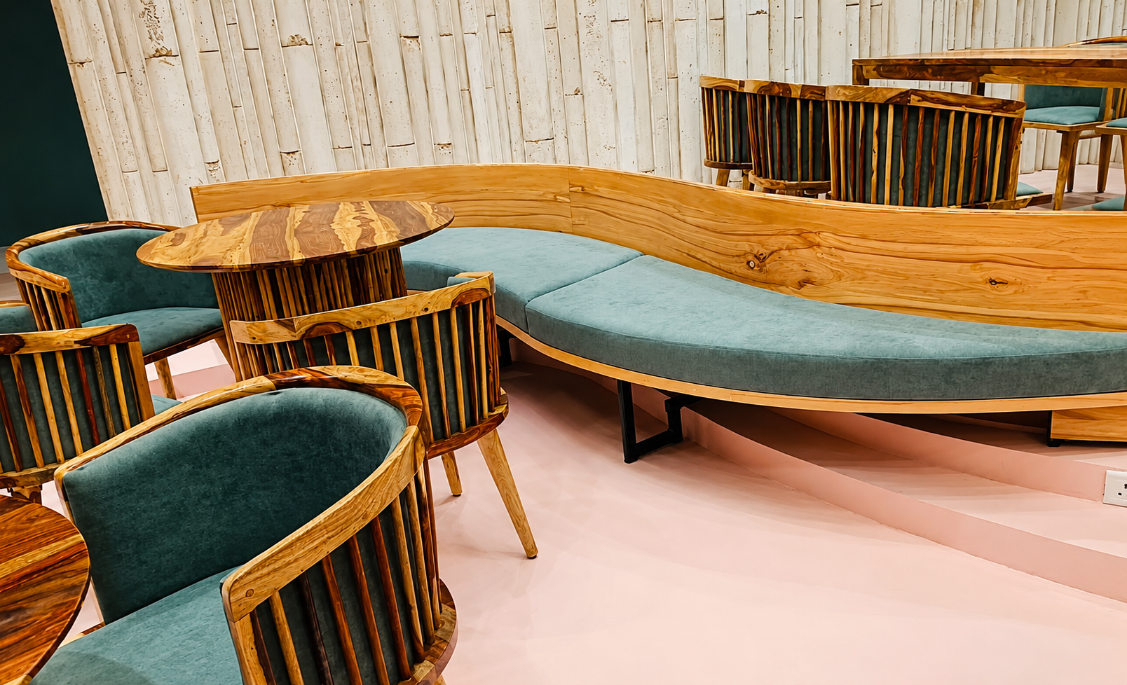 Bespoke curved wood and steel restaurant furniture by Lotey Metalcrafts