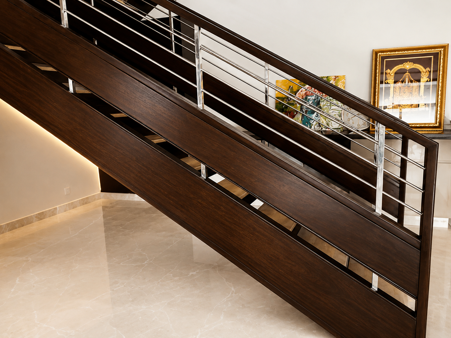 Precision dark wood and stainless steel staircase railing by Lotey Metalcrafts